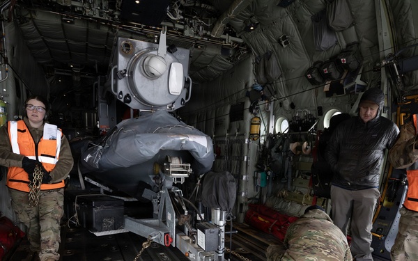 176th Wing air transportation specialists and loadmasters work together