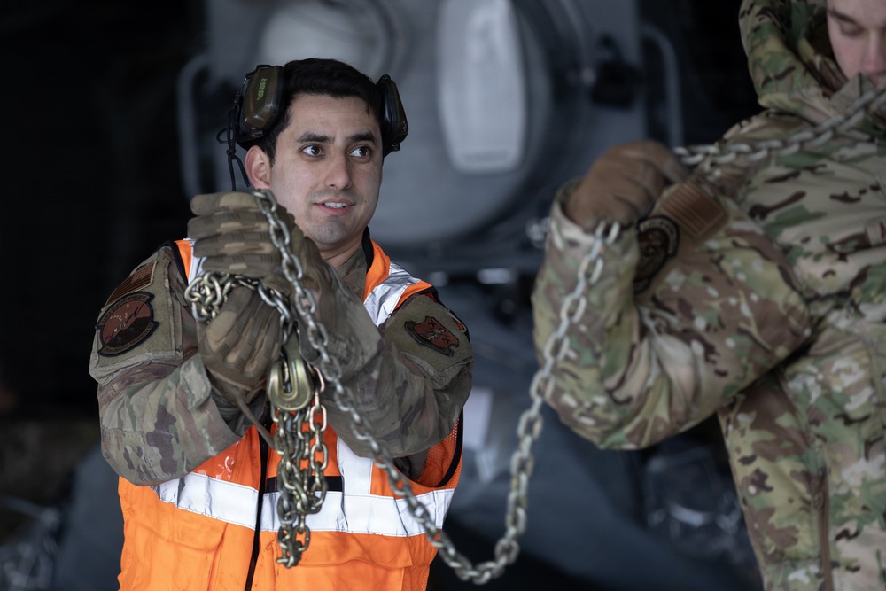 176th Wing air transportation specialists and loadmasters work together