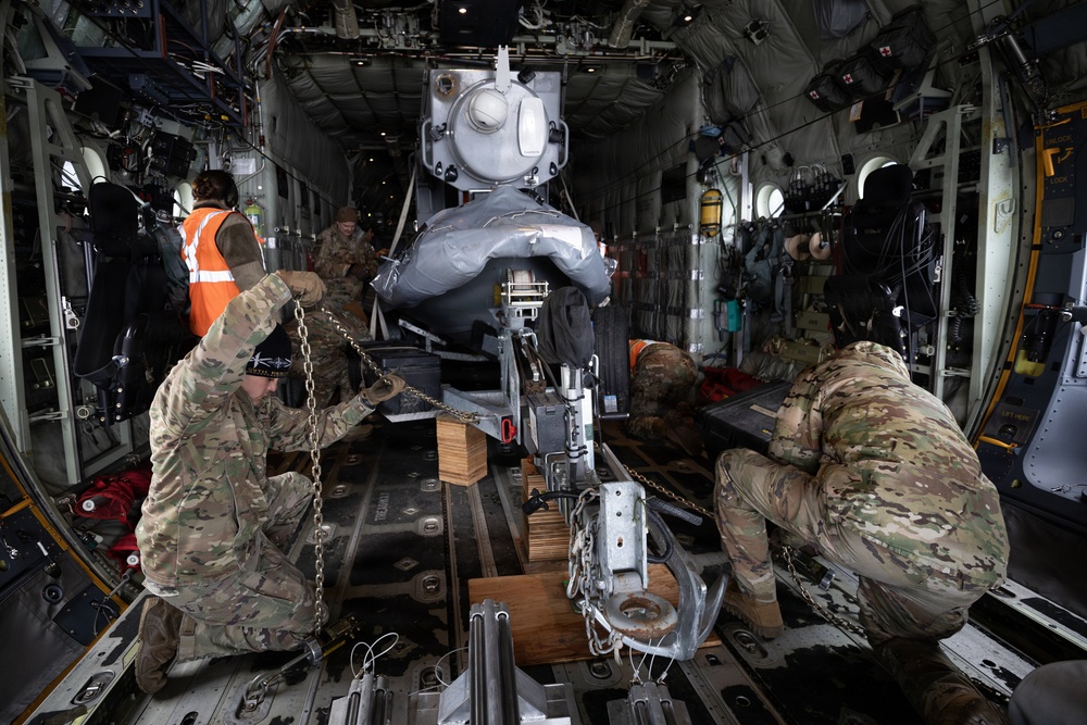 176th Wing air transportation specialists and loadmasters work together