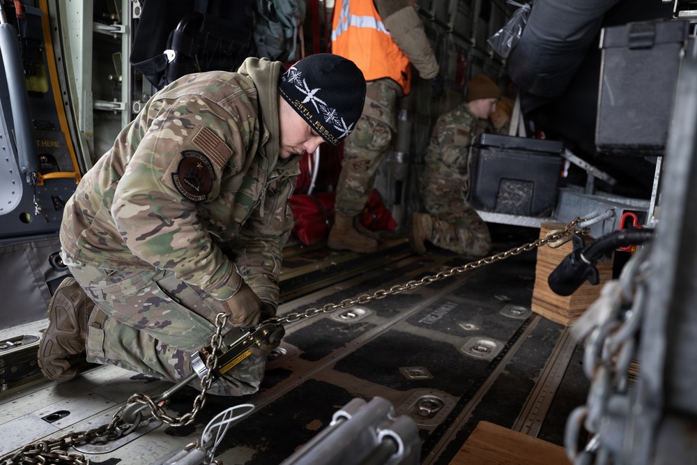 176th Wing air transportation specialists and loadmasters work together