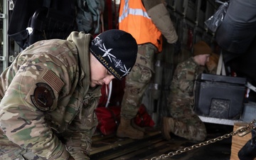 176th Wing air transportation specialists and loadmasters work together