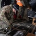 176th Wing air transportation specialists and loadmasters work together