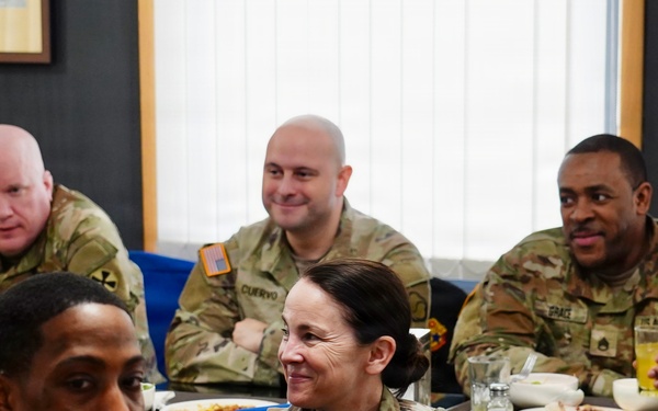 Command team shares a meal with soldiers