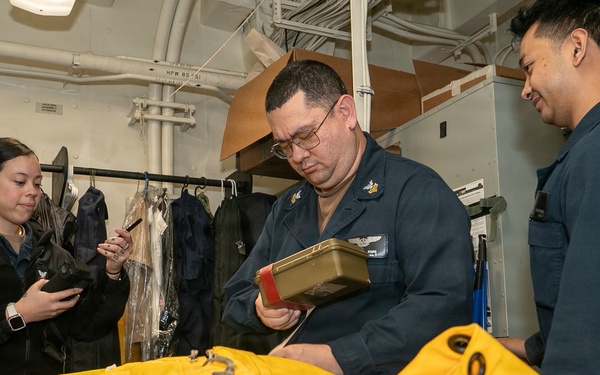 USS Tripoli Sailors Conducts Inflatable Raft Maintenance