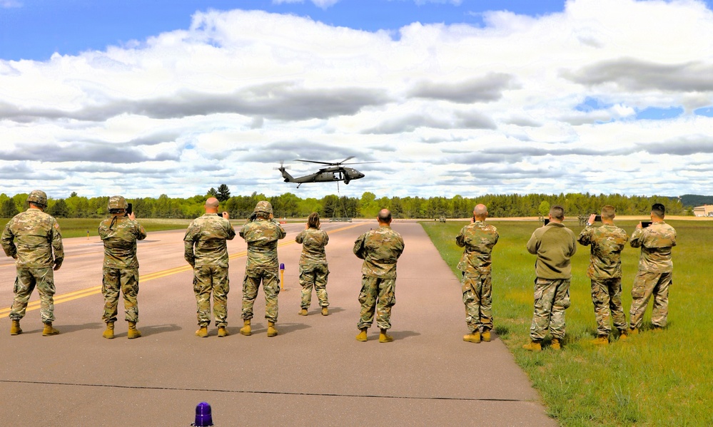 Soldiers with 13th Battalion, 100th Regiment hold slingload training at McCoy; Wisconsin National Guard Black Hawks, crews assist