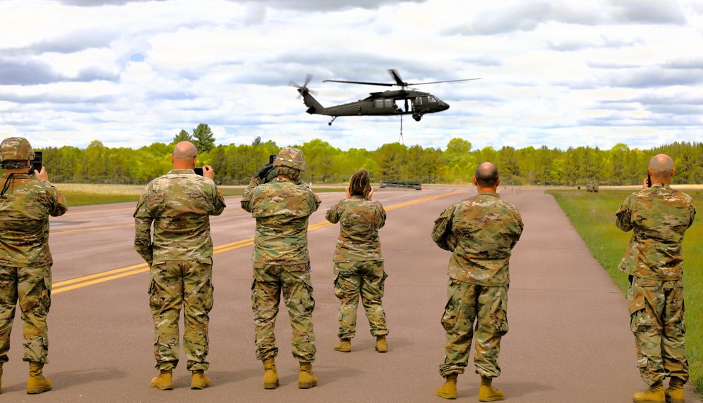 Soldiers with 13th Battalion, 100th Regiment hold slingload training at McCoy; Wisconsin National Guard Black Hawks, crews assist