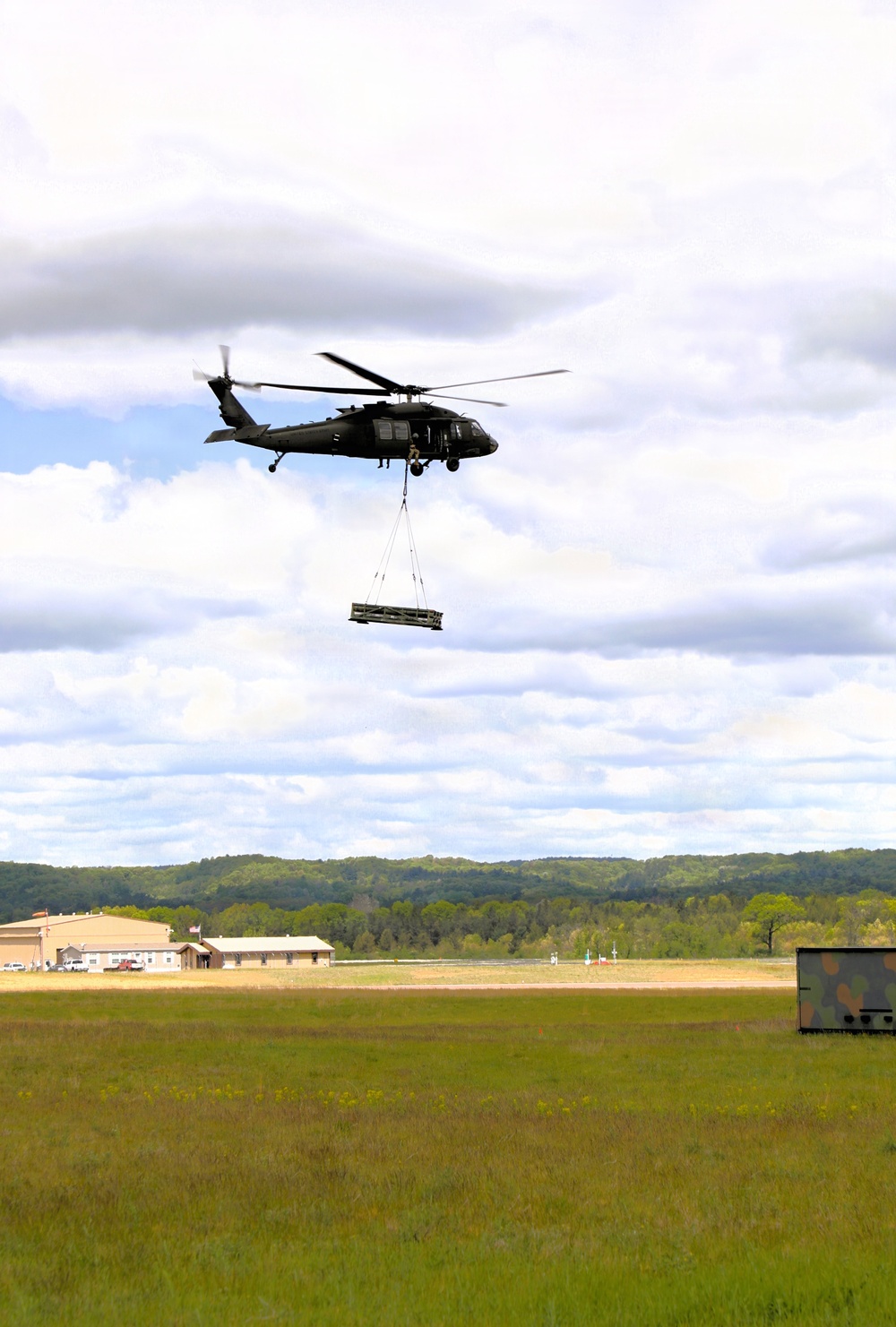 Soldiers with 13th Battalion, 100th Regiment hold slingload training at McCoy; Wisconsin National Guard Black Hawks, crews assist
