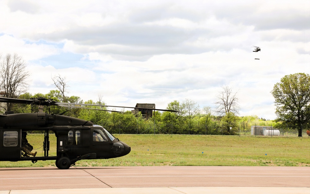 Soldiers with 13th Battalion, 100th Regiment hold slingload training at McCoy; Wisconsin National Guard Black Hawks, crews assist