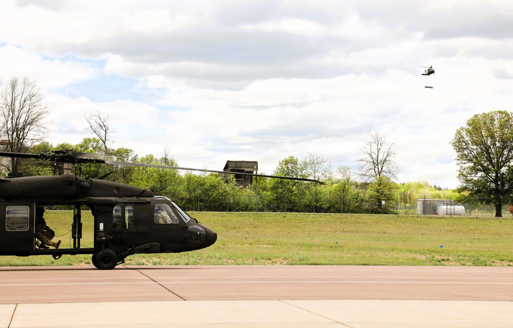 Soldiers with 13th Battalion, 100th Regiment hold slingload training at McCoy; Wisconsin National Guard Black Hawks, crews assist