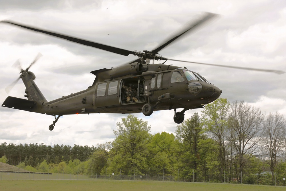 Soldiers with 13th Battalion, 100th Regiment hold slingload training at McCoy; Wisconsin National Guard Black Hawks, crews assist