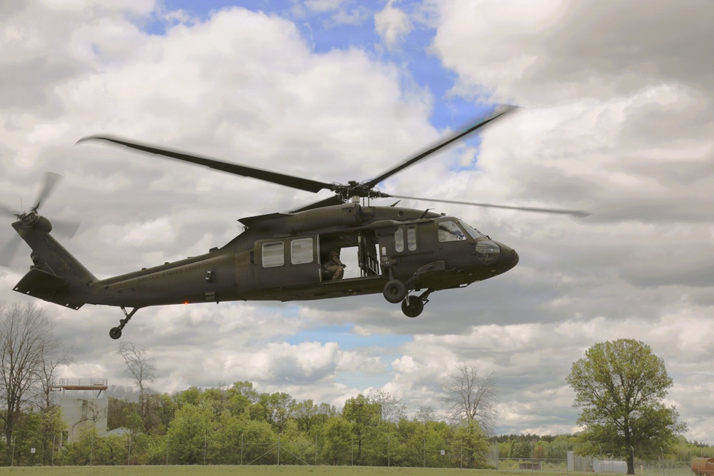 Soldiers with 13th Battalion, 100th Regiment hold slingload training at McCoy; Wisconsin National Guard Black Hawks, crews assist
