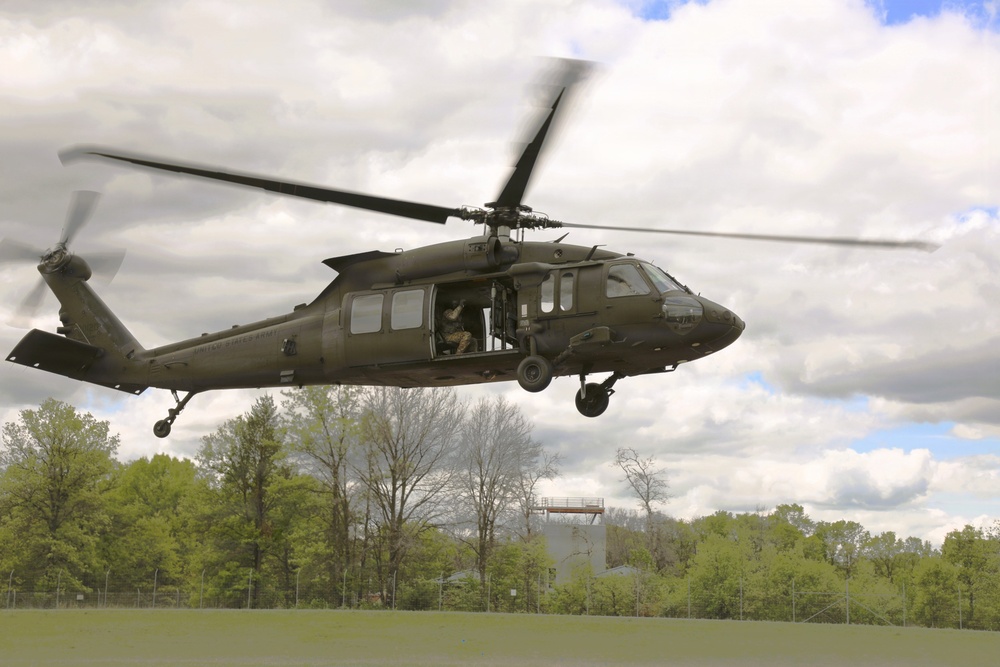 Soldiers with 13th Battalion, 100th Regiment hold slingload training at McCoy; Wisconsin National Guard Black Hawks, crews assist