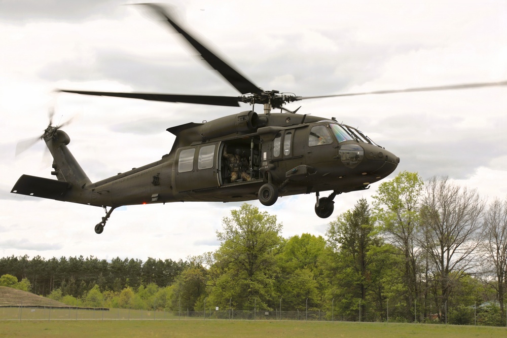 Soldiers with 13th Battalion, 100th Regiment hold slingload training at McCoy; Wisconsin National Guard Black Hawks, crews assist