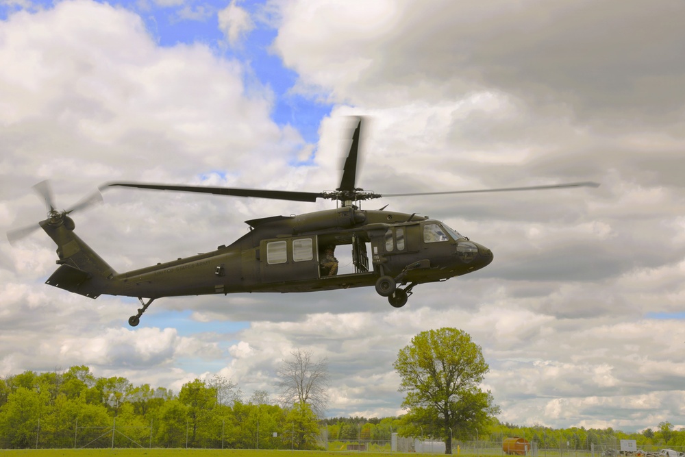 Soldiers with 13th Battalion, 100th Regiment hold slingload training at McCoy; Wisconsin National Guard Black Hawks, crews assist
