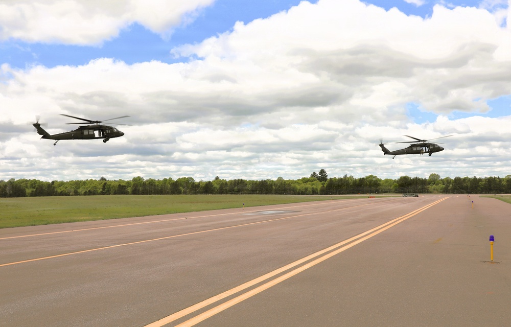 Soldiers with 13th Battalion, 100th Regiment hold slingload training at McCoy; Wisconsin National Guard Black Hawks, crews assist
