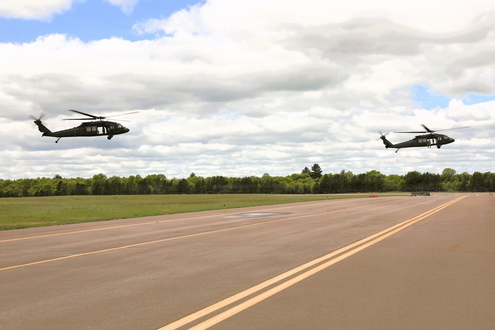 Soldiers with 13th Battalion, 100th Regiment hold slingload training at McCoy; Wisconsin National Guard Black Hawks, crews assist