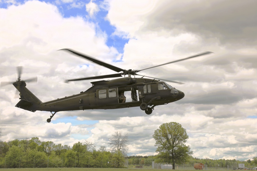 Soldiers with 13th Battalion, 100th Regiment hold slingload training at McCoy; Wisconsin National Guard Black Hawks, crews assist