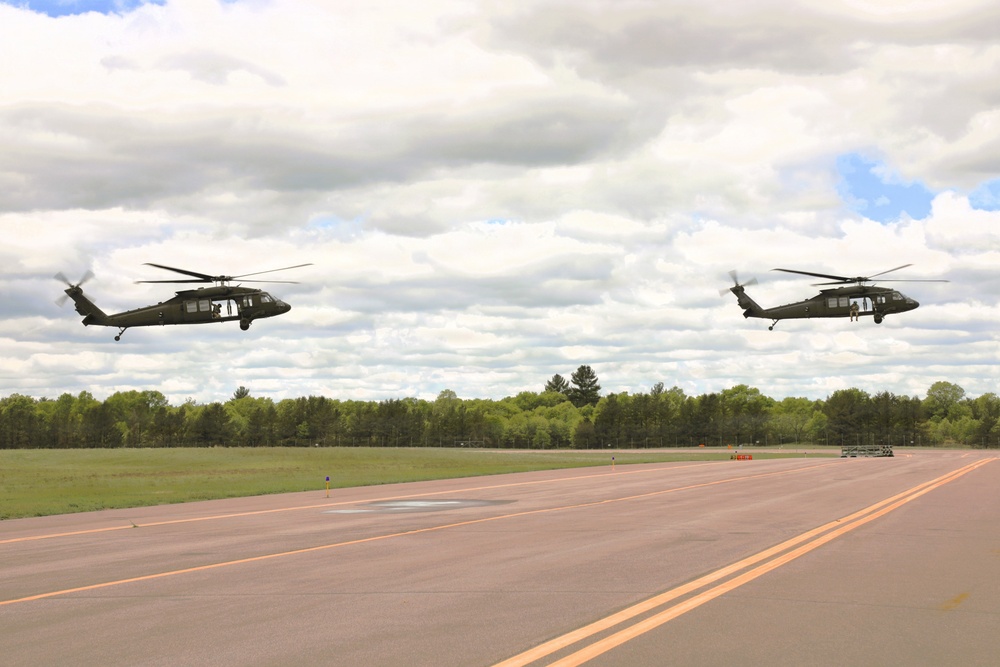 Soldiers with 13th Battalion, 100th Regiment hold slingload training at McCoy; Wisconsin National Guard Black Hawks, crews assist