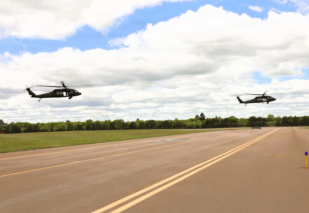 Soldiers with 13th Battalion, 100th Regiment hold slingload training at McCoy; Wisconsin National Guard Black Hawks, crews assist