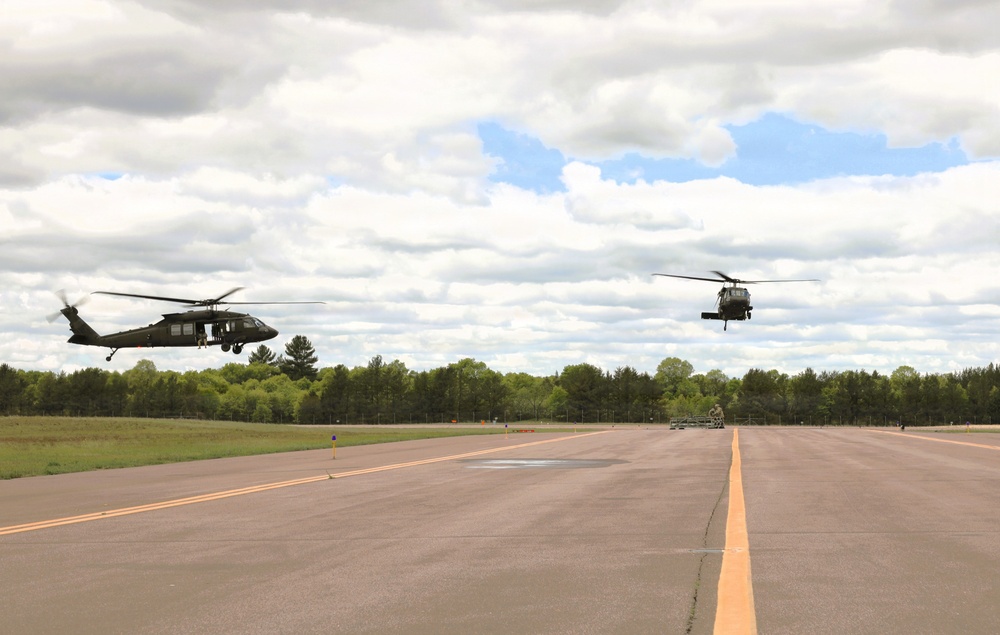 Soldiers with 13th Battalion, 100th Regiment hold slingload training at McCoy; Wisconsin National Guard Black Hawks, crews assist
