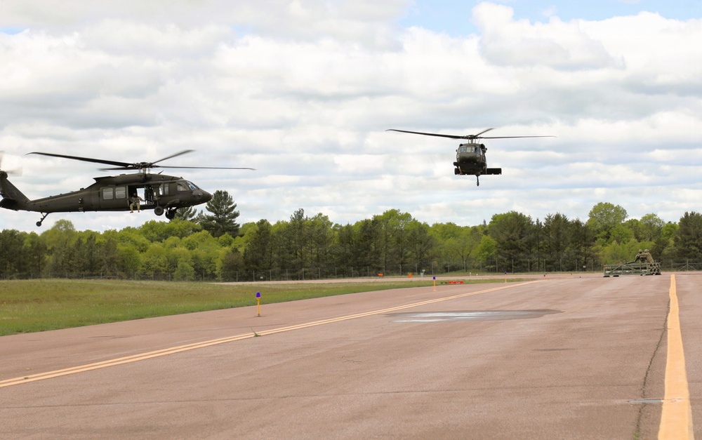 Soldiers with 13th Battalion, 100th Regiment hold slingload training at McCoy; Wisconsin National Guard Black Hawks, crews assist