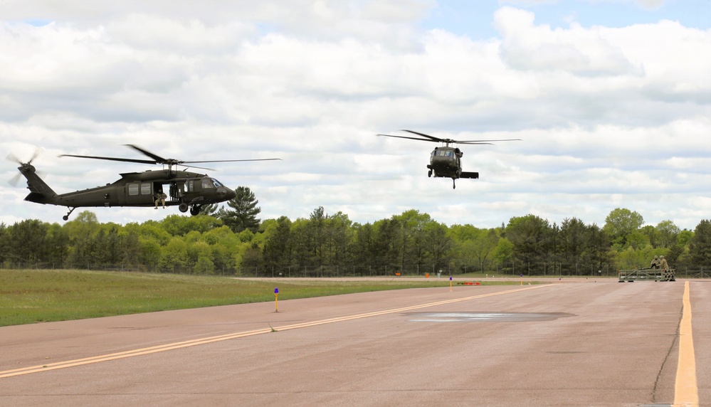 Soldiers with 13th Battalion, 100th Regiment hold slingload training at McCoy; Wisconsin National Guard Black Hawks, crews assist