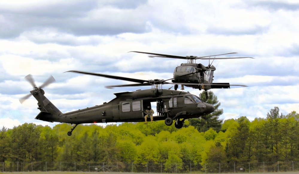 Soldiers with 13th Battalion, 100th Regiment hold slingload training at McCoy; Wisconsin National Guard Black Hawks, crews assist