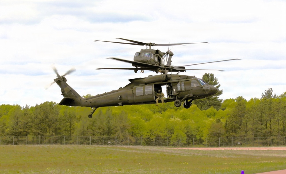 Soldiers with 13th Battalion, 100th Regiment hold slingload training at McCoy; Wisconsin National Guard Black Hawks, crews assist