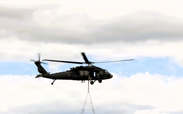 Soldiers with 13th Battalion, 100th Regiment hold slingload training at McCoy; Wisconsin National Guard Black Hawks, crews assist
