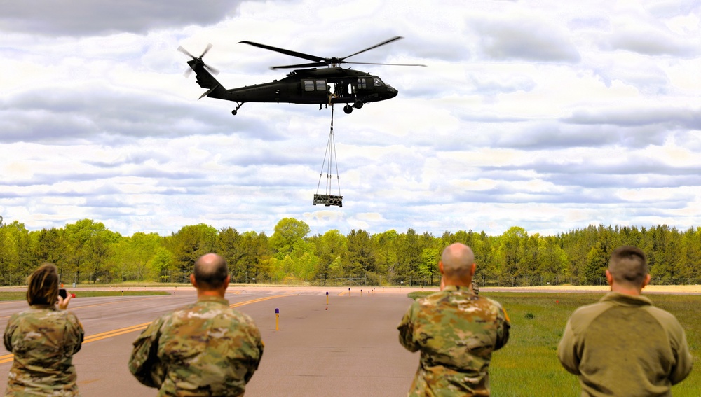 Soldiers with 13th Battalion, 100th Regiment hold slingload training at McCoy; Wisconsin National Guard Black Hawks, crews assist