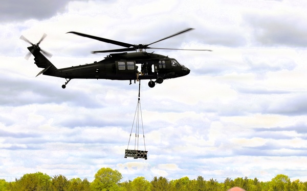Soldiers with 13th Battalion, 100th Regiment hold slingload training at McCoy; Wisconsin National Guard Black Hawks, crews assist