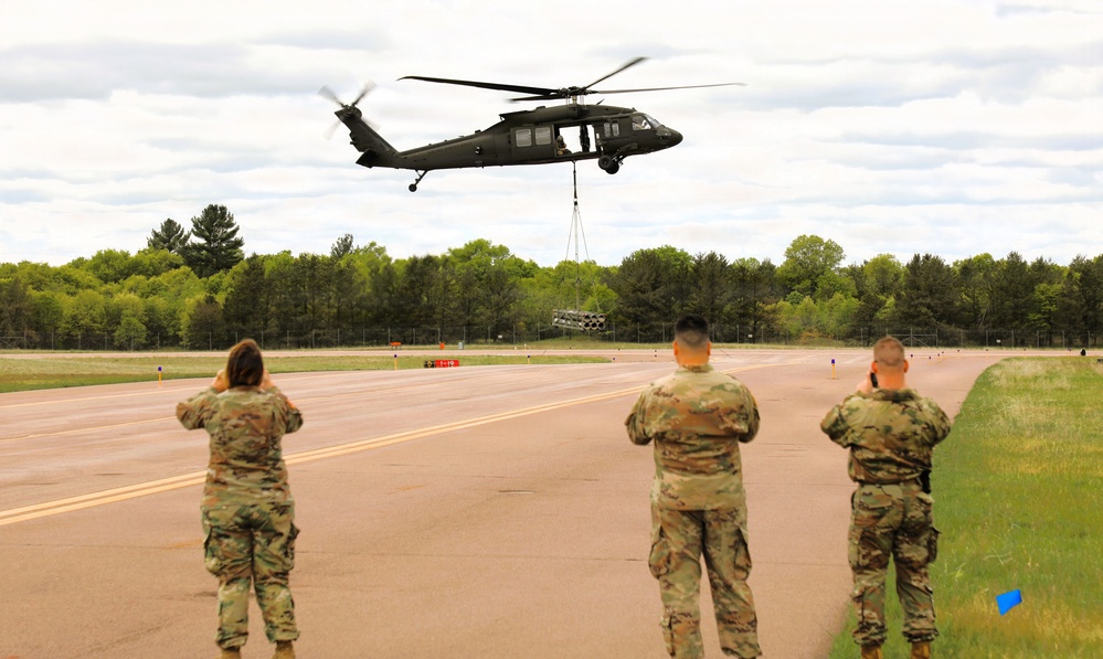 Soldiers with 13th Battalion, 100th Regiment hold slingload training at McCoy; Wisconsin National Guard Black Hawks, crews assist