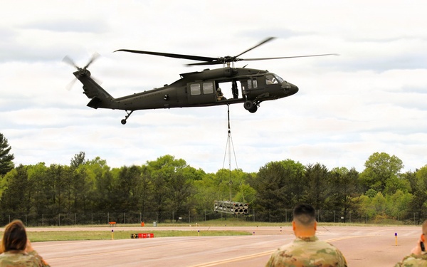 Soldiers with 13th Battalion, 100th Regiment hold slingload training at McCoy; Wisconsin National Guard Black Hawks, crews assist