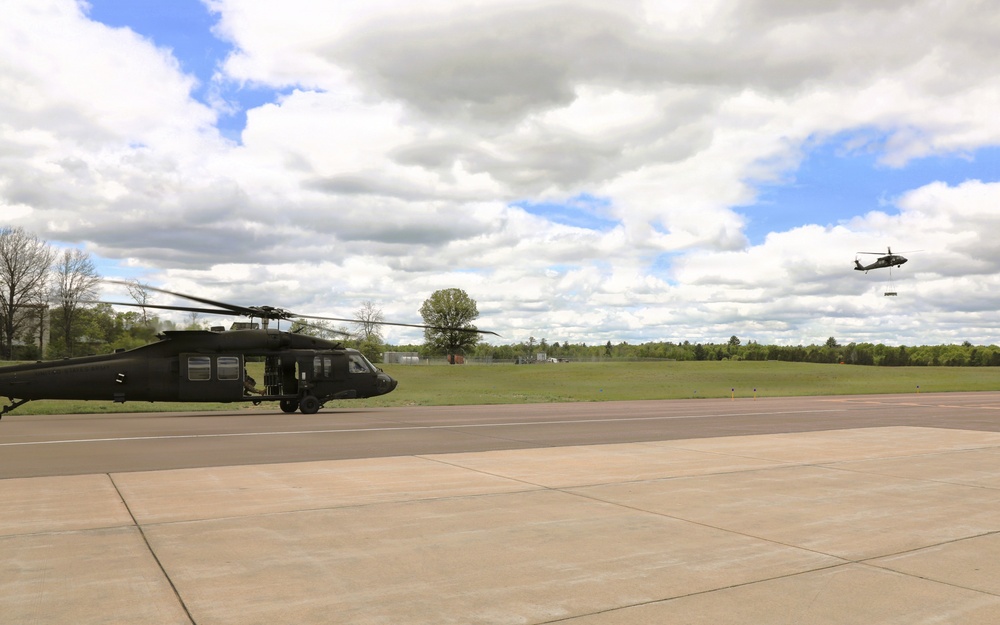 Soldiers with 13th Battalion, 100th Regiment hold slingload training at McCoy; Wisconsin National Guard Black Hawks, crews assist