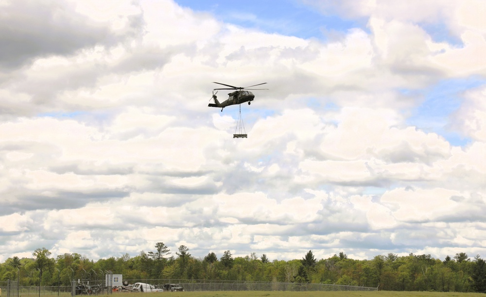 Soldiers with 13th Battalion, 100th Regiment hold slingload training at McCoy; Wisconsin National Guard Black Hawks, crews assist