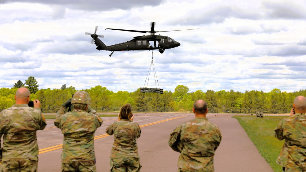 Soldiers with 13th Battalion, 100th Regiment hold slingload training at McCoy; Wisconsin National Guard Black Hawks, crews assist