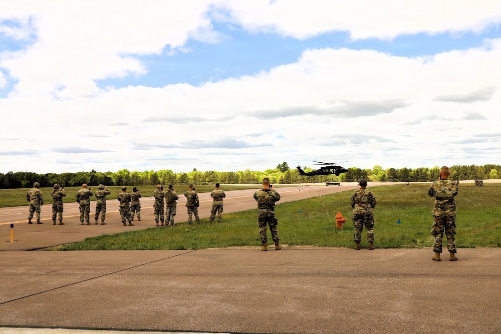 Soldiers with 13th Battalion, 100th Regiment hold slingload training at McCoy; Wisconsin National Guard Black Hawks, crews assist