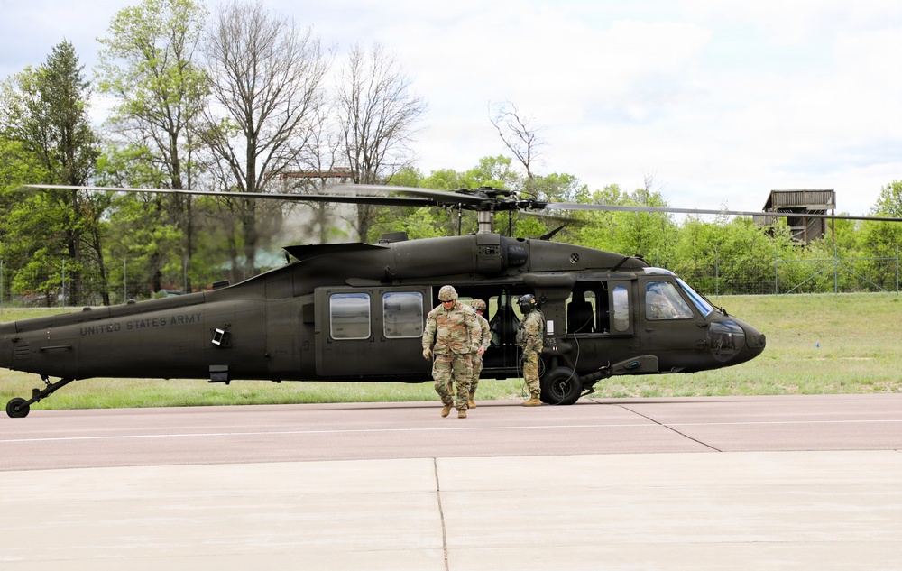 Soldiers with 13th Battalion, 100th Regiment hold slingload training at McCoy; Wisconsin National Guard Black Hawks, crews assist