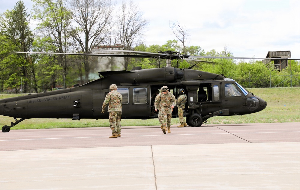 Soldiers with 13th Battalion, 100th Regiment hold slingload training at McCoy; Wisconsin National Guard Black Hawks, crews assist