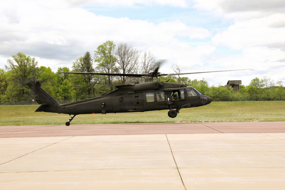 Soldiers with 13th Battalion, 100th Regiment hold slingload training at McCoy; Wisconsin National Guard Black Hawks, crews assist