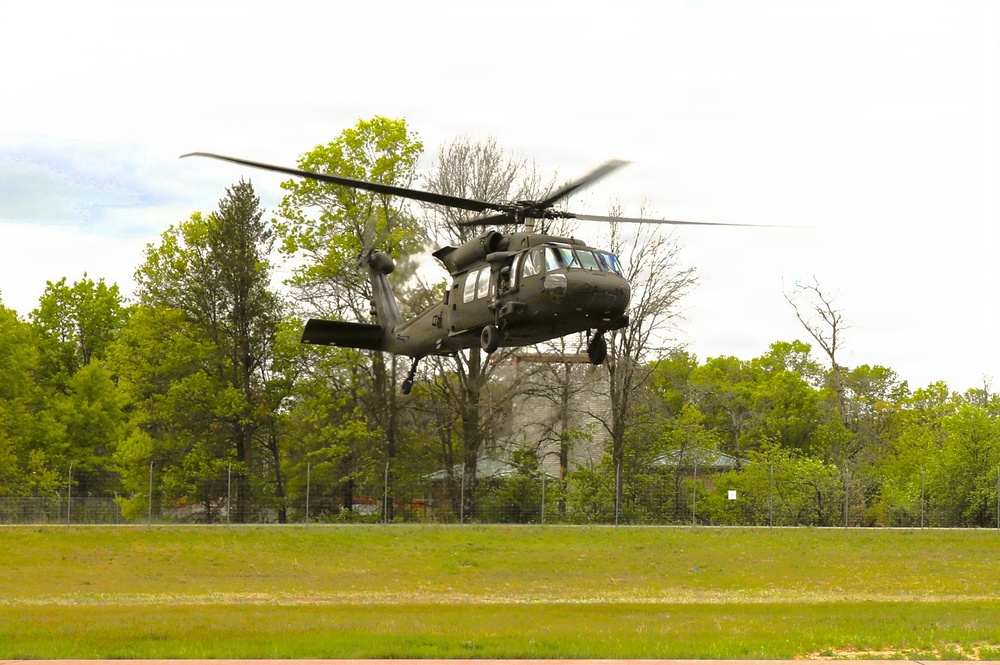 Soldiers with 13th Battalion, 100th Regiment hold slingload training at McCoy; Wisconsin National Guard Black Hawks, crews assist