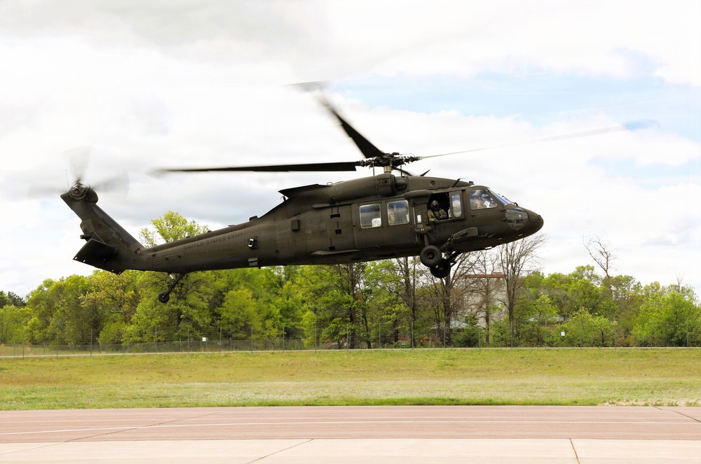 Soldiers with 13th Battalion, 100th Regiment hold slingload training at McCoy; Wisconsin National Guard Black Hawks, crews assist