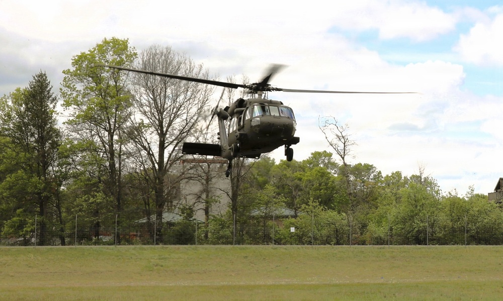 Soldiers with 13th Battalion, 100th Regiment hold slingload training at McCoy; Wisconsin National Guard Black Hawks, crews assist
