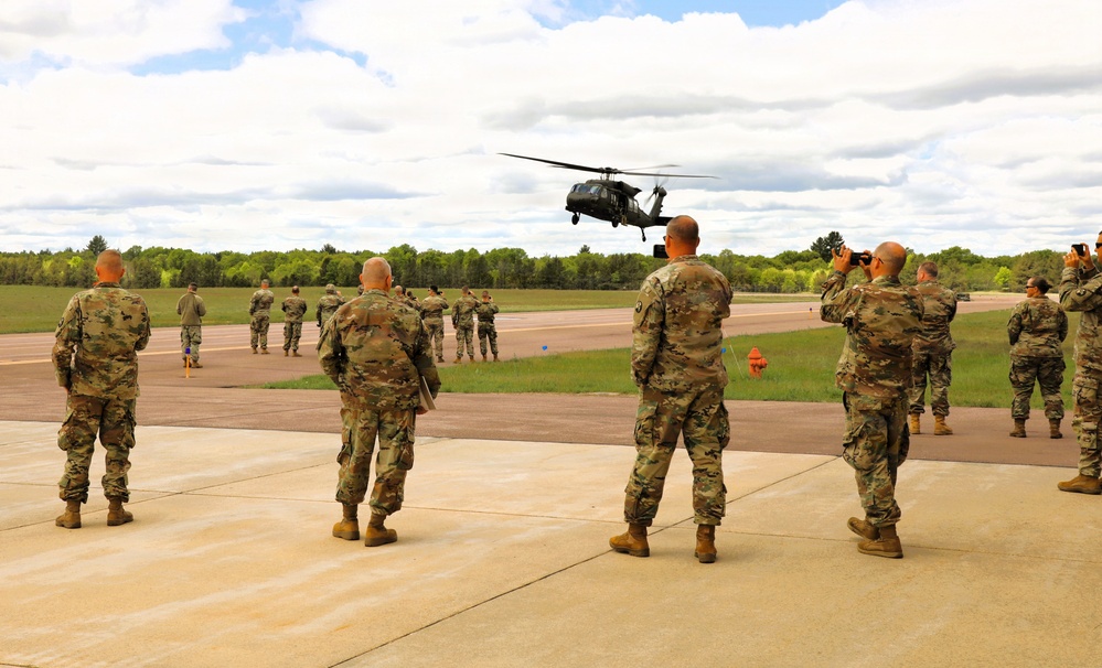 Soldiers with 13th Battalion, 100th Regiment hold slingload training at McCoy; Wisconsin National Guard Black Hawks, crews assist