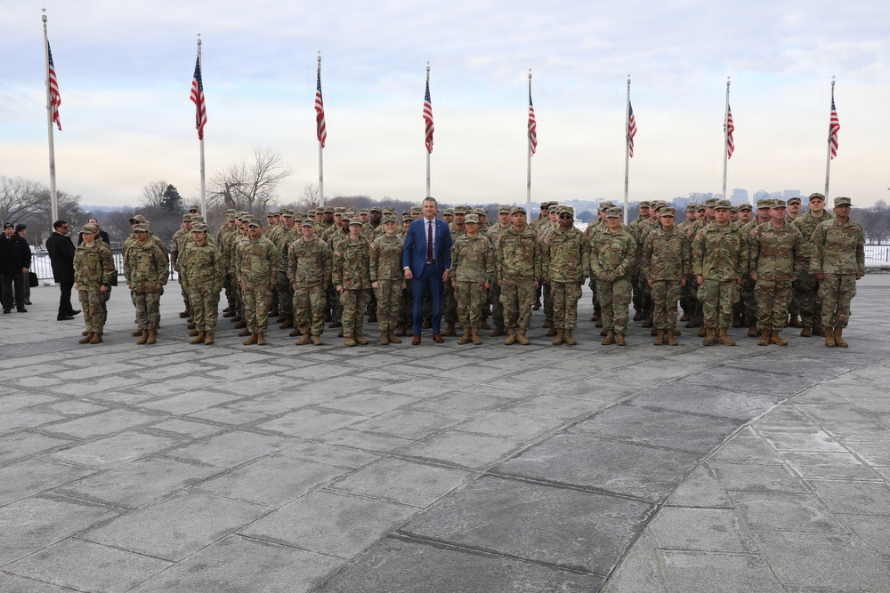 Secretary of War Pete Hegseth officiates the oath of enlistment to a formation of National Guard Soldiers