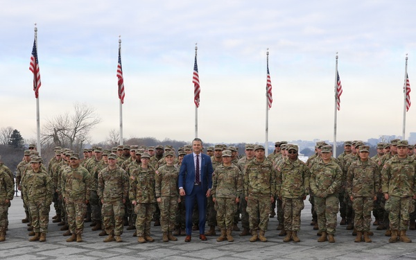 Secretary of War Pete Hegseth officiates the oath of enlistment to a formation of National Guard Soldiers