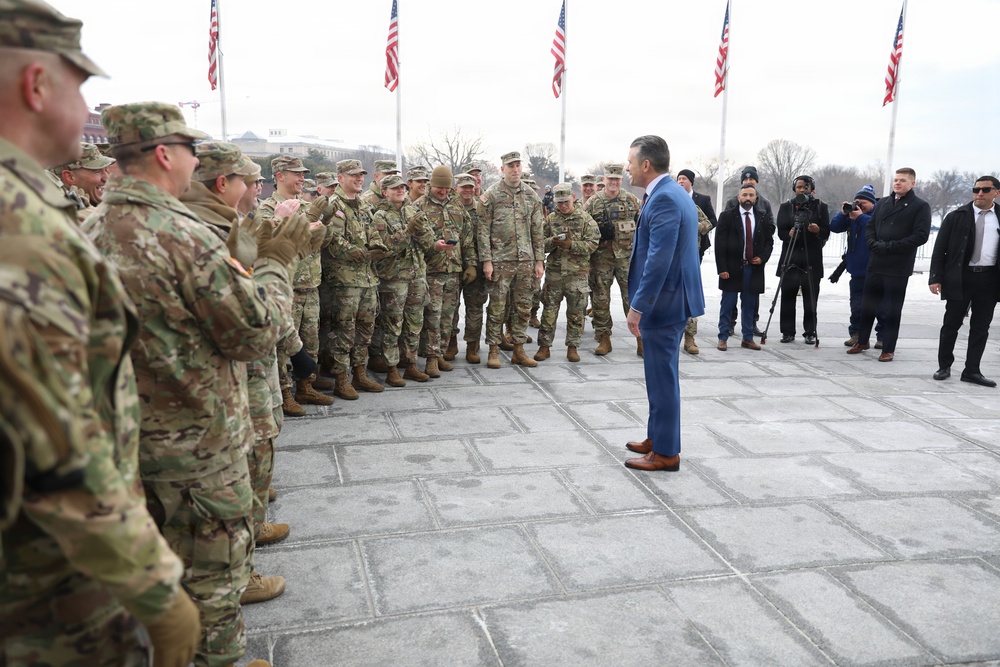 Secretary of War Pete Hegseth officiates the oath of enlistment to a formation of National Guard Soldiers