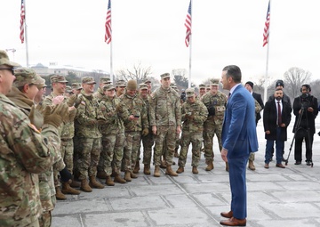 Secretary of War Pete Hegseth officiates the oath of enlistment to a formation of National Guard Soldiers