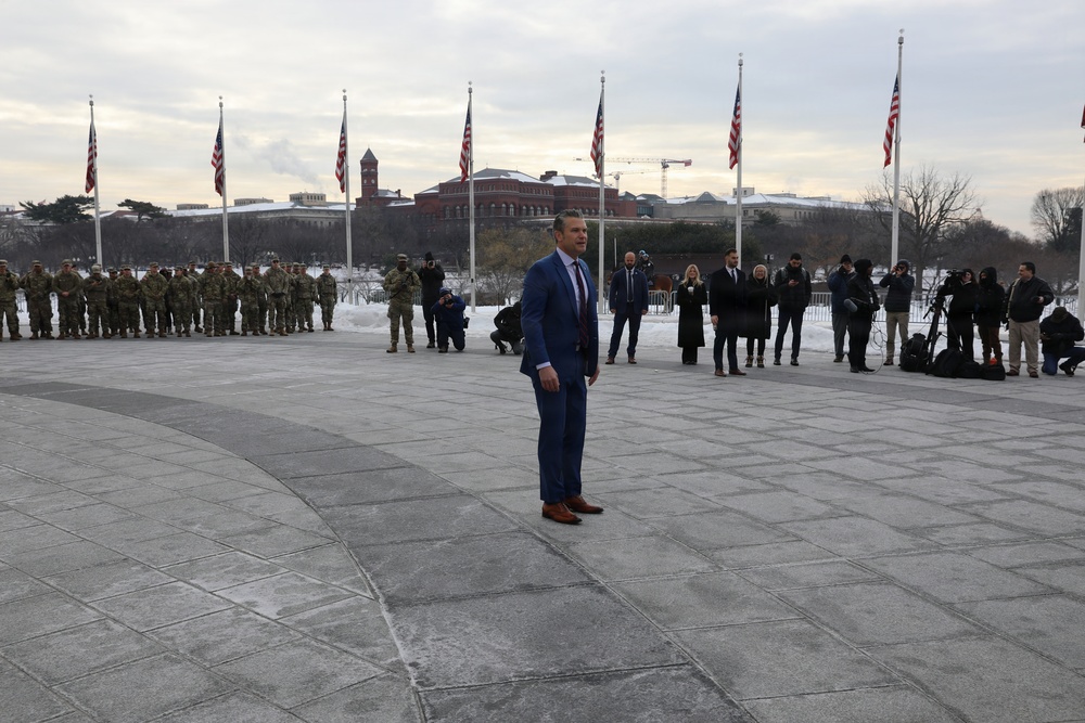 Secretary of War Pete Hegseth officiates the oath of enlistment to a formation of National Guard Soldiers