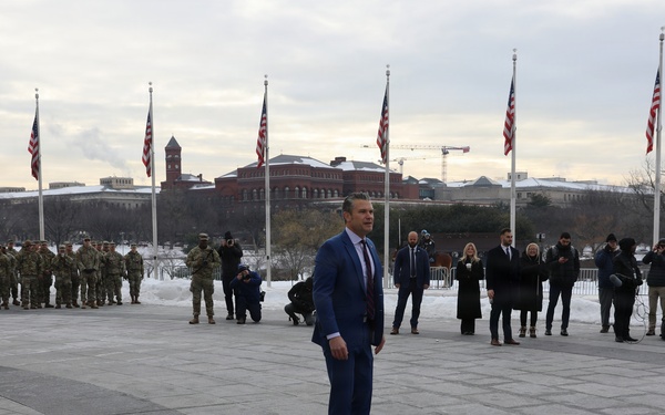 Secretary of War Pete Hegseth officiates the oath of enlistment to a formation of National Guard Soldiers
